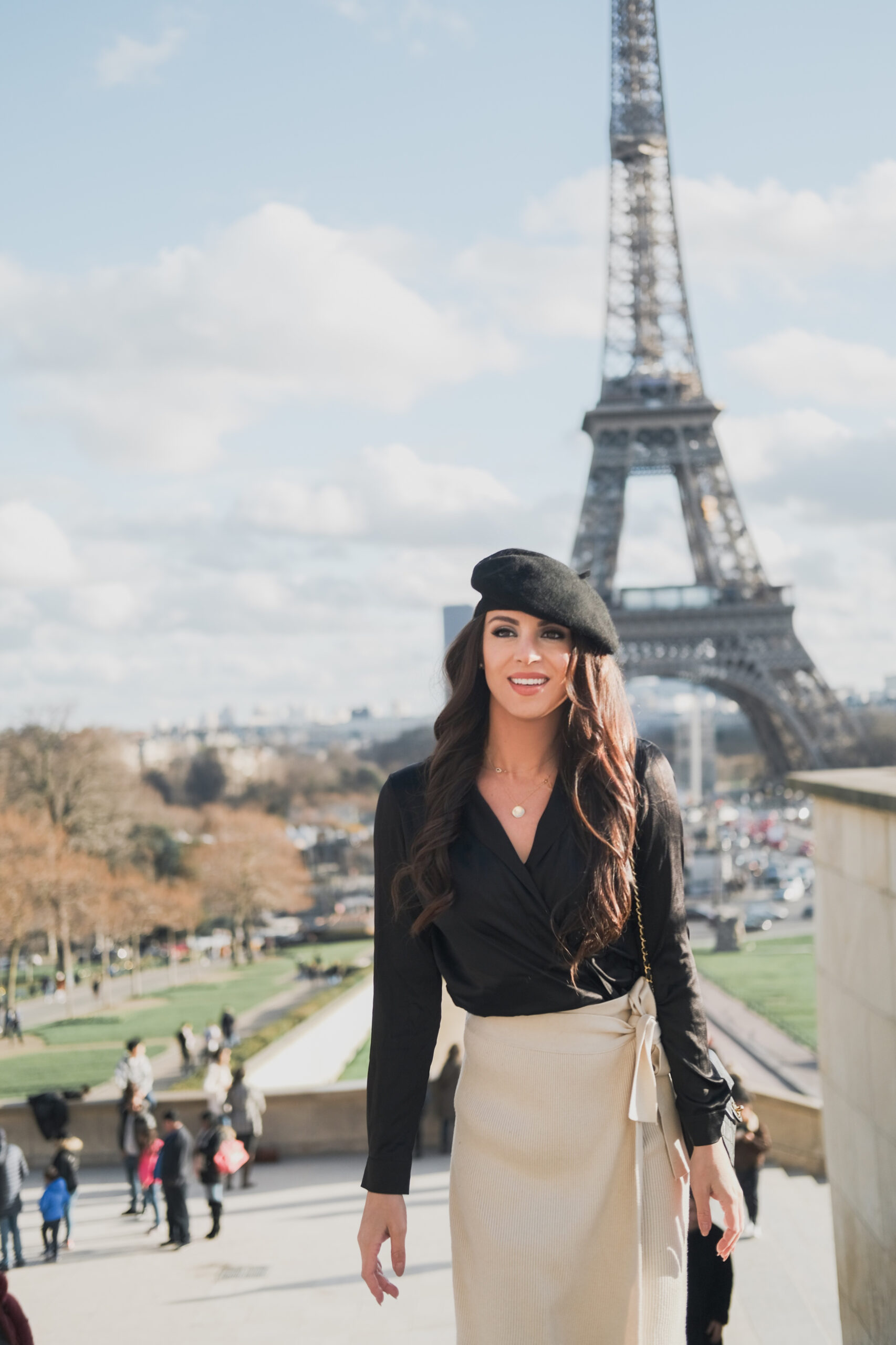 erica matchmaker in Paris France standing at Eiffel tower